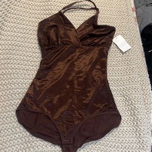 Skims sheer body suit.